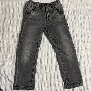 Grey stoned washed next.82 jeans